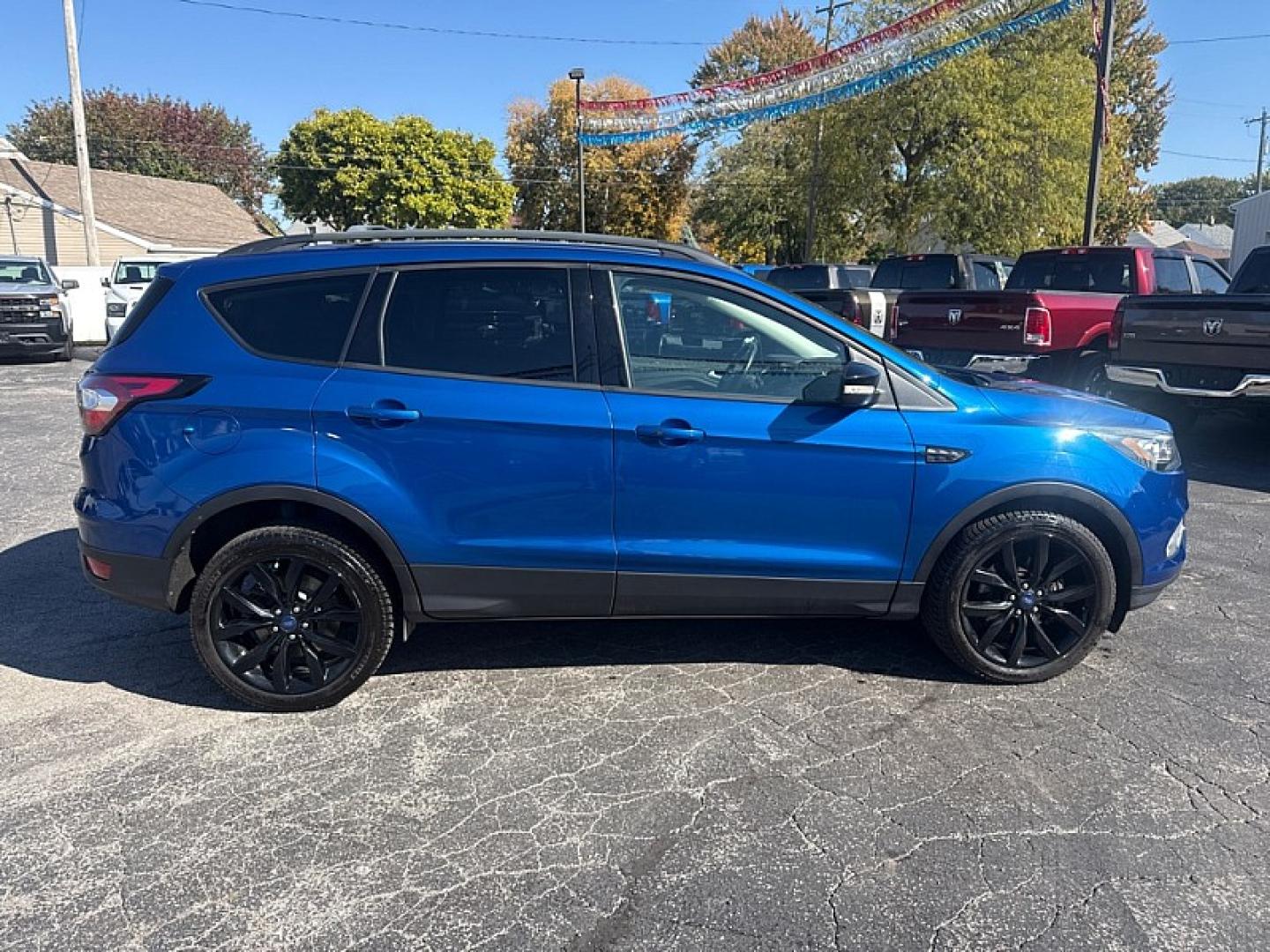 2017 BLUE /BLACK Ford Escape Titanium 4WD (1FMCU9J95HU) with an 2.0L L4 DOHC 16V engine, 6A transmission, located at 3304 Woodville Road, Northwood, OH, 43619, (419) 210-8019, 41.612694, -83.480743 - Your #1 Destination for Auto Loans and mdash;No Matter Your Credit!At our dealership, we believe everyone deserves the opportunity to drive their dream car and mdash;whether you have good credit, bad credit, or no credit at all. With a wide selection of hundreds of cars, trucks, and SUVs, you'll fin- Photo#5