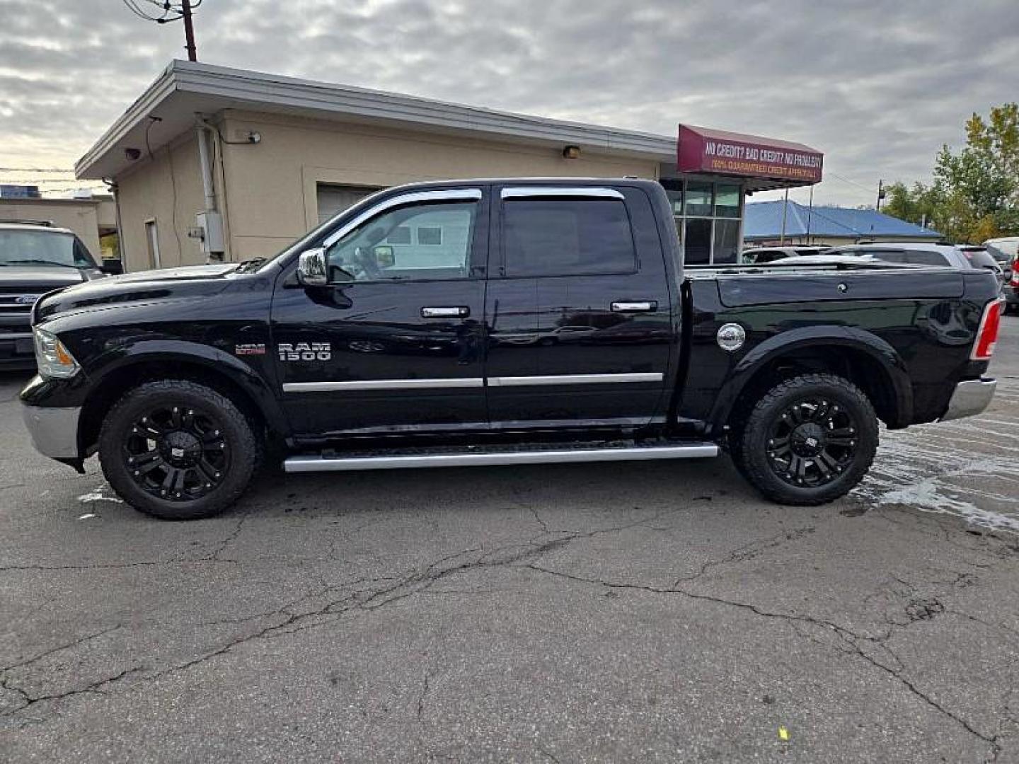 2015 BLACK /BLACK RAM 1500 Longhorn Crew Cab SWB 4WD (1C6RR7PTXFS) with an 5.7L V8 OHV 16V engine, 6-Speed Automatic transmission, located at 3304 Woodville Road, Northwood, OH, 43619, (419) 210-8019, 41.612694, -83.480743 - Photo#1